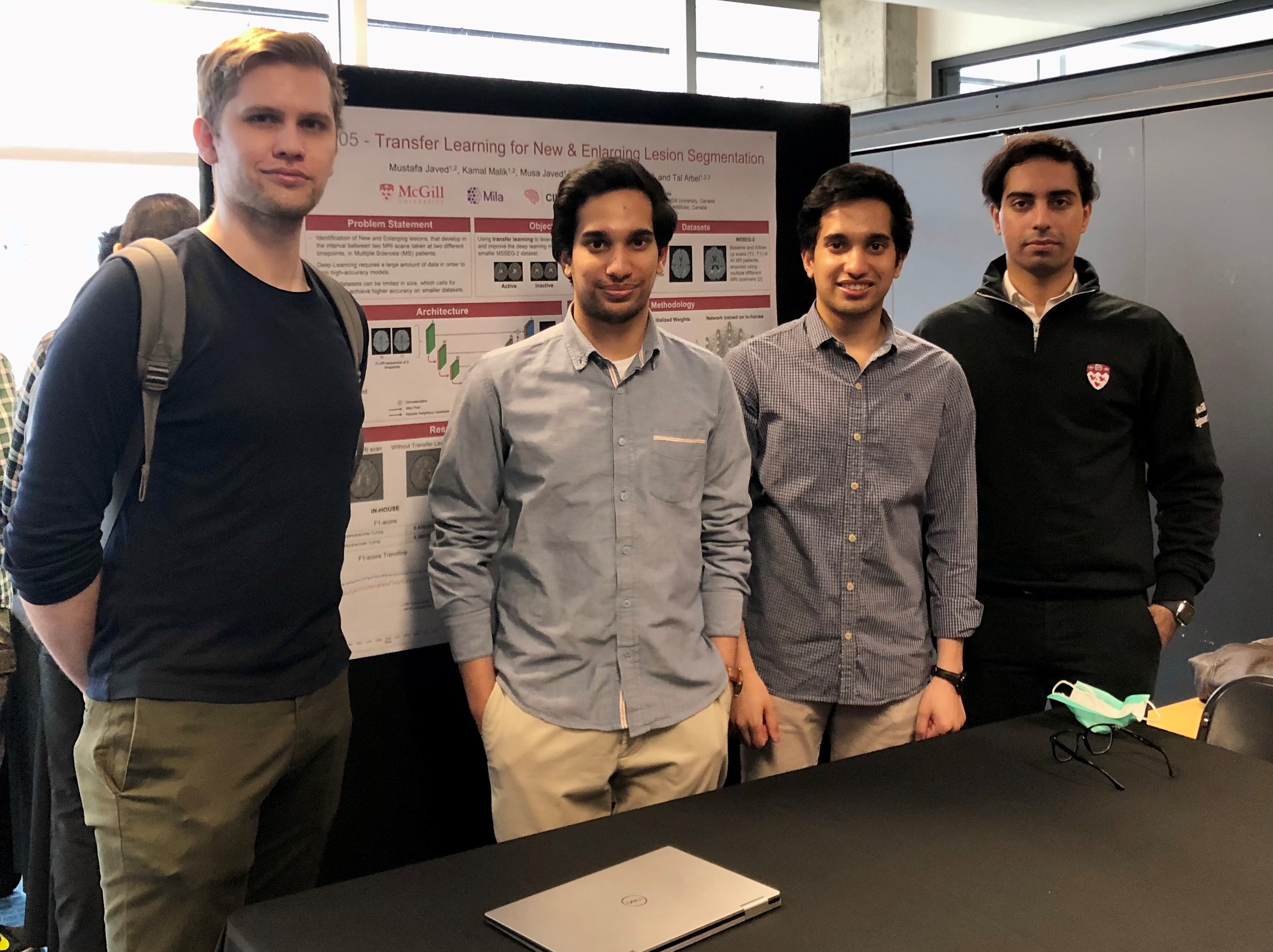 Brennan and Undergraduate students showcasing their research at Design Day
